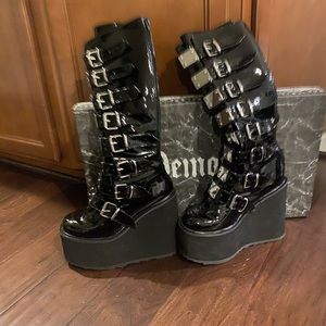 Demonia Black boots with a silver buckles. Like new
